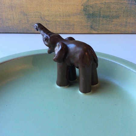 Green bowl with brown elephant