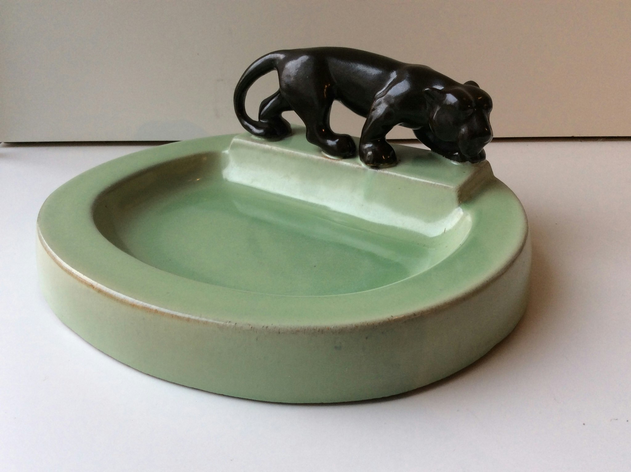 Brown panther on green ashtray 52