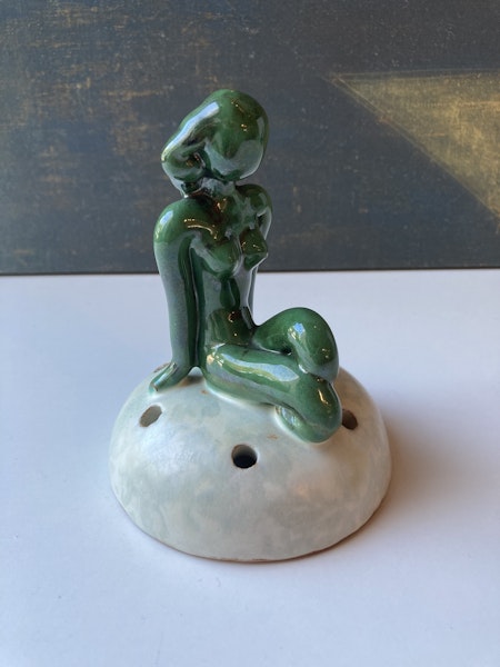 Green lady on greyish flower holder 30