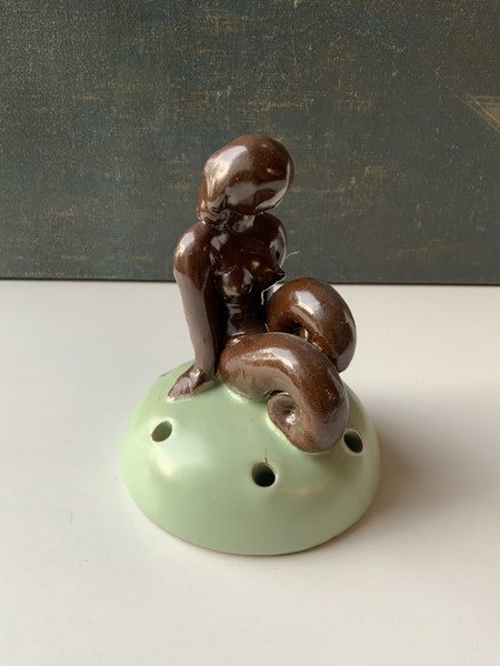 Brown lady on green flower holder 30