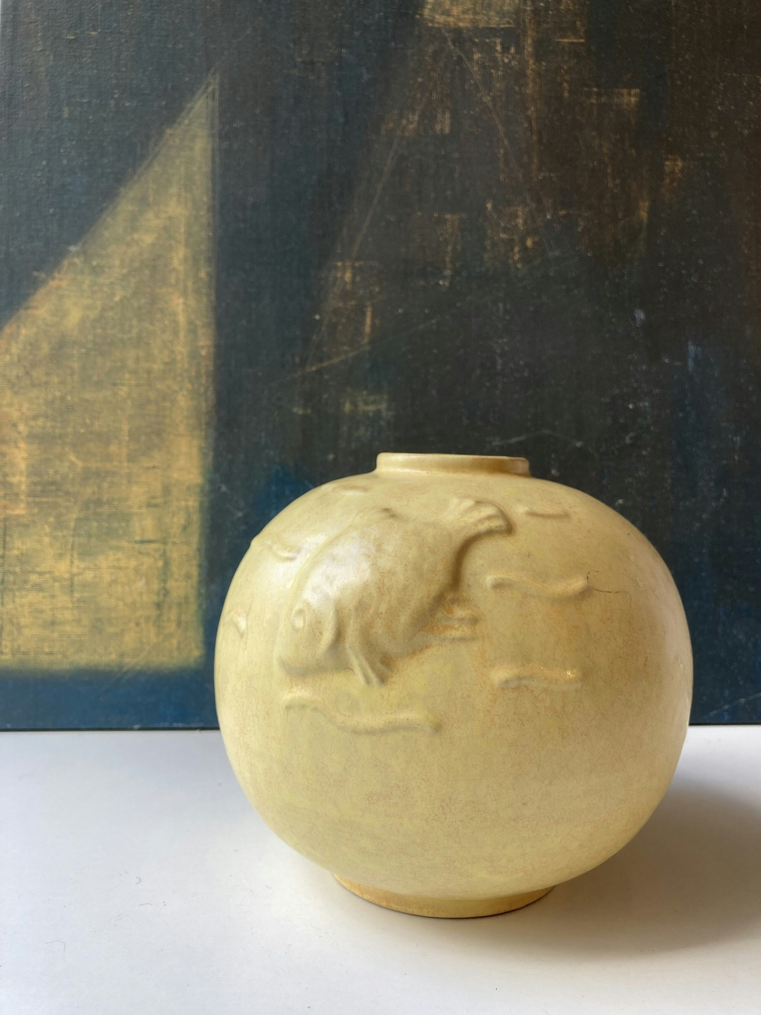Globe vase with fish relief