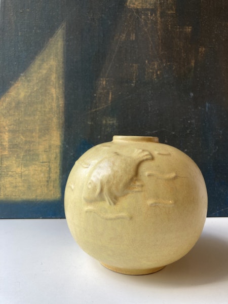 Globe vase with fish relief