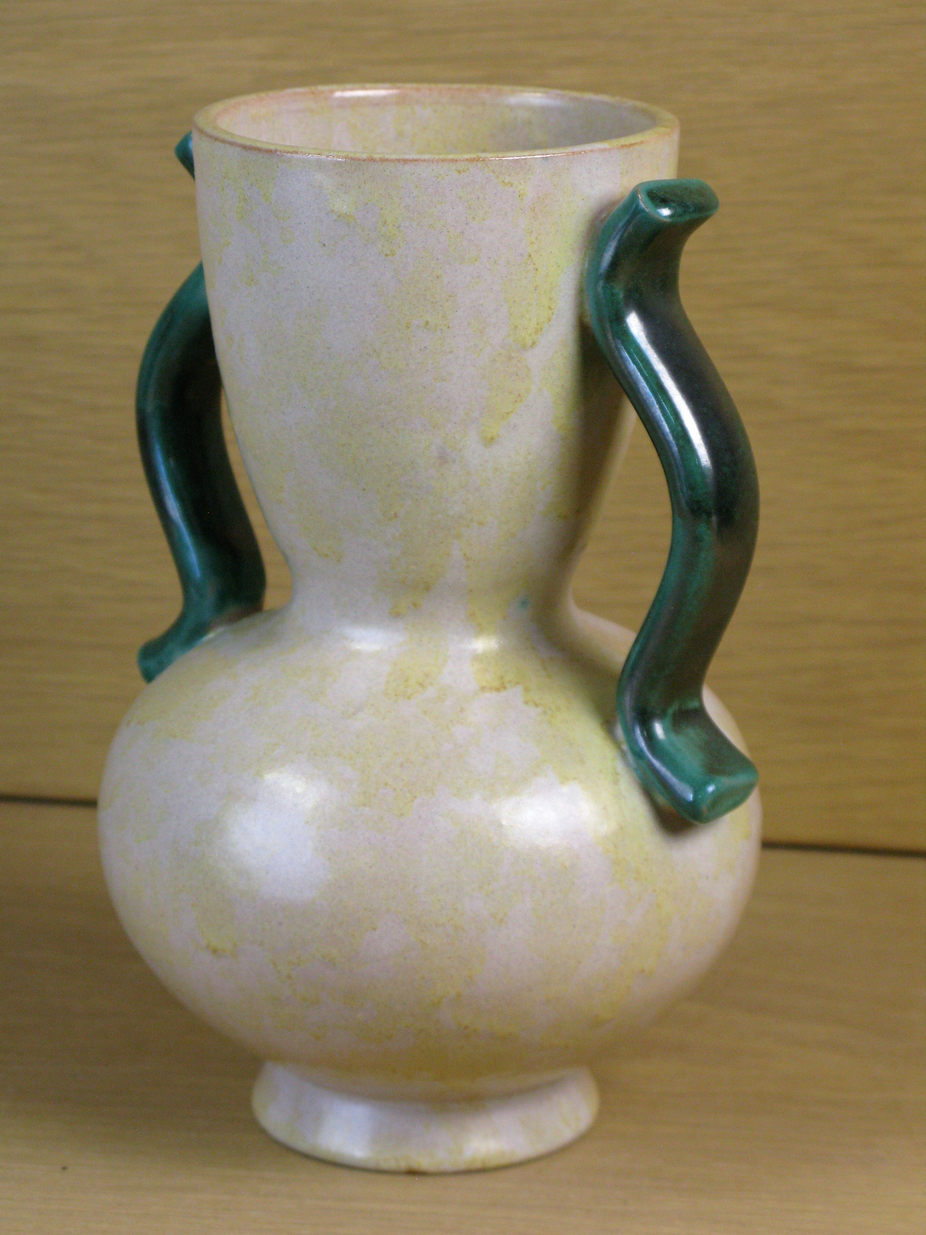 yelowish vase with green handles 283