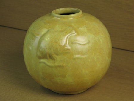 Yellow vase with fish relief