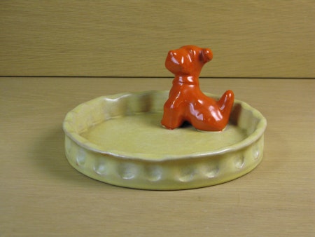 orange dog in yellowish bowl 12