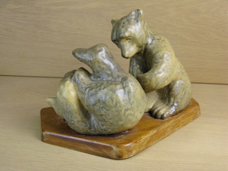 playing bears on wooden plate