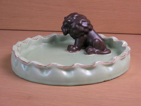 brown lion in green bowl 12