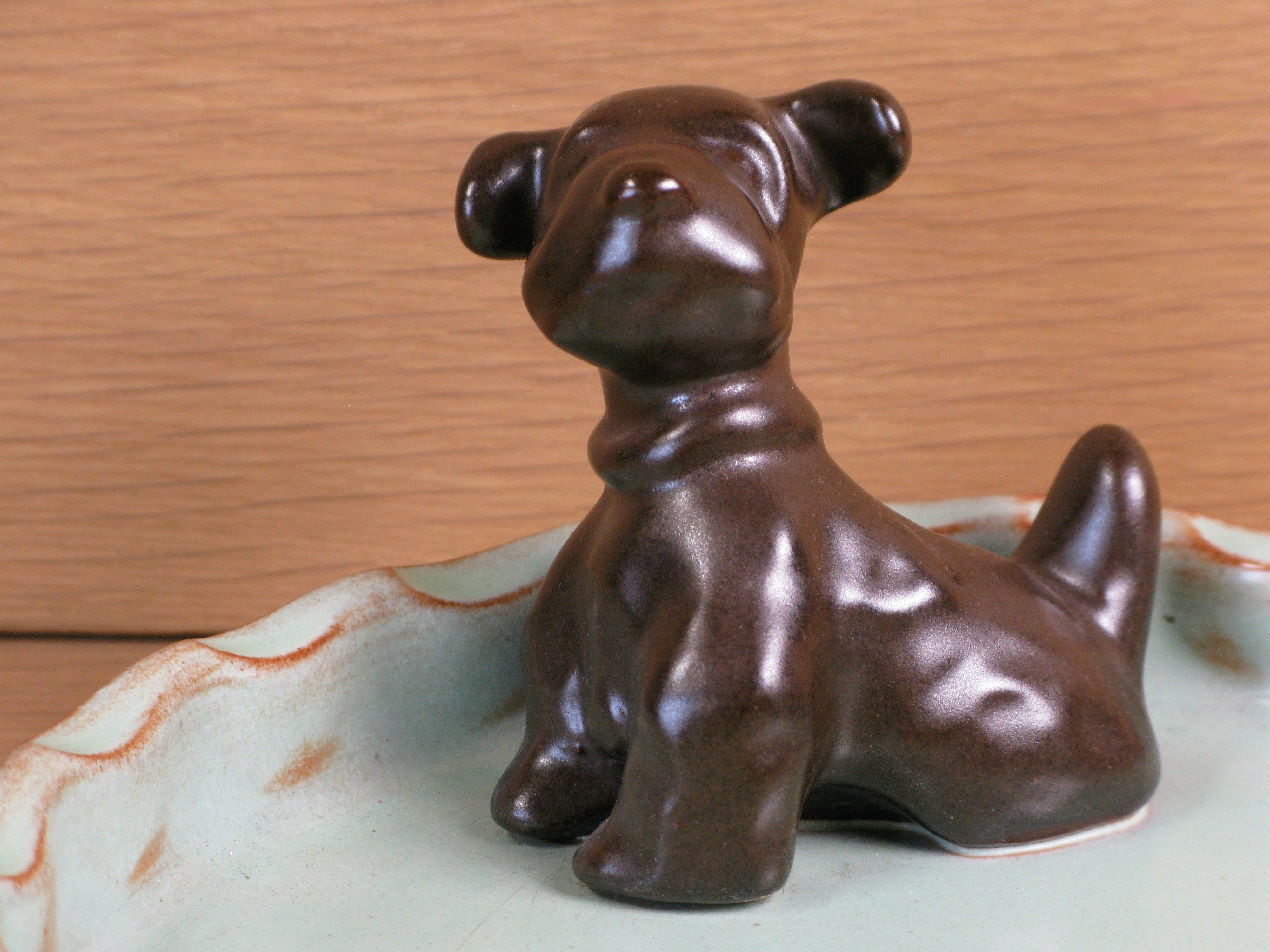 brown dog in green ashtray 12