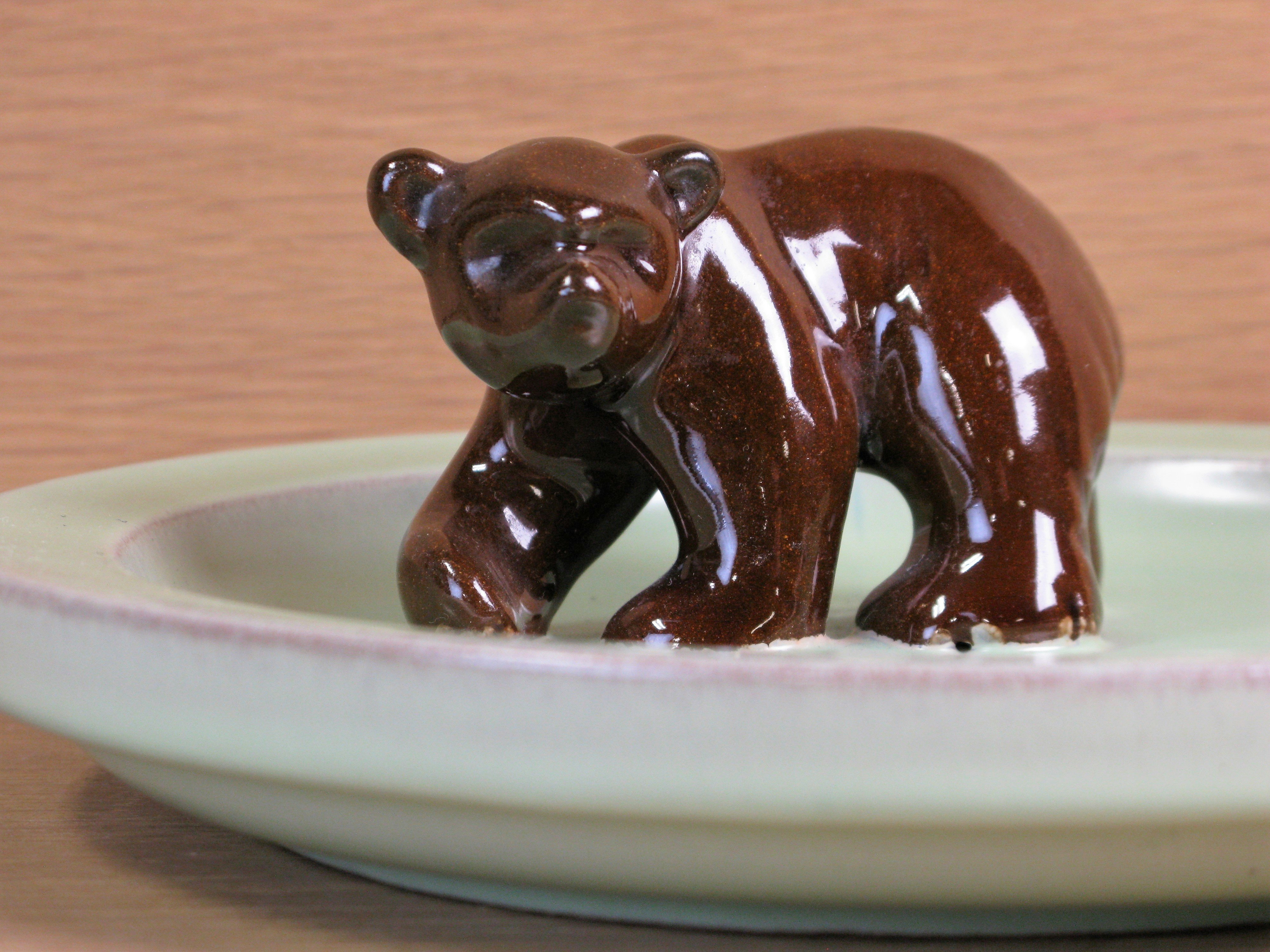 brown bear in green ashtray 46