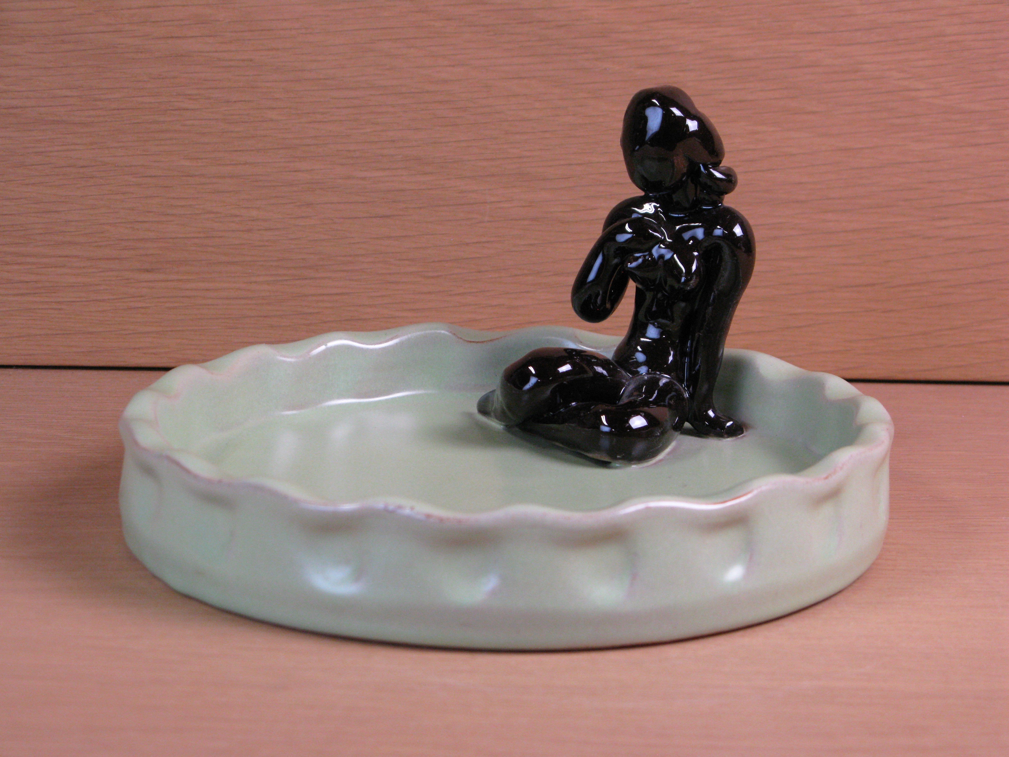 brown lady in green bowl 12
