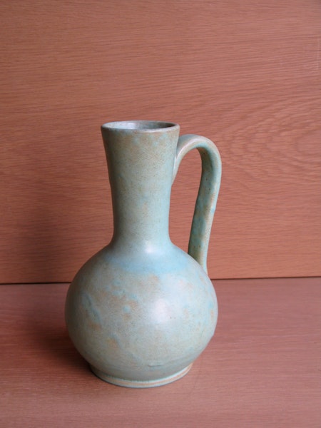greenish vase with handle