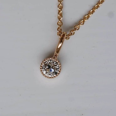 "Twinkle" pendant in gold with an 0.41ct old european cut diamond