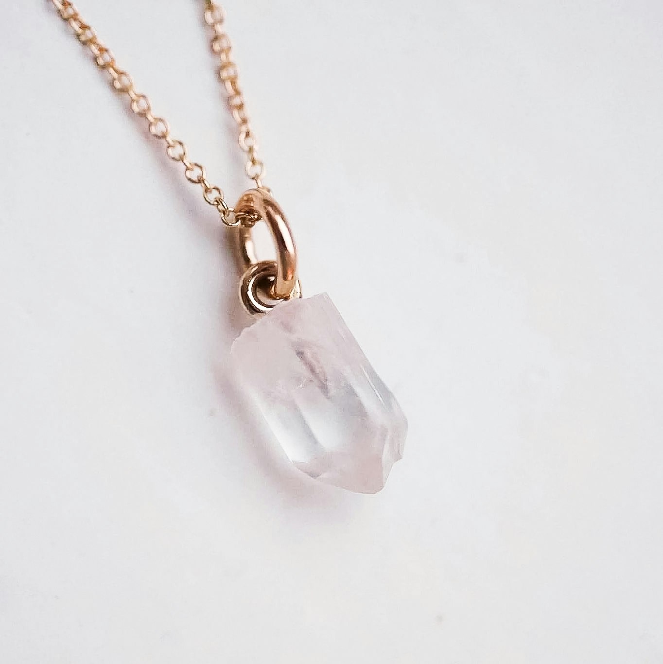 "Swedish Ice" Pendant in gold with a raw Swedish rock crystal