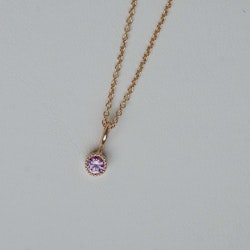 "Twinkle" pendant in gold with a pink sapphire