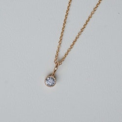 "Twinkle" hänge i guld med en grå diamant