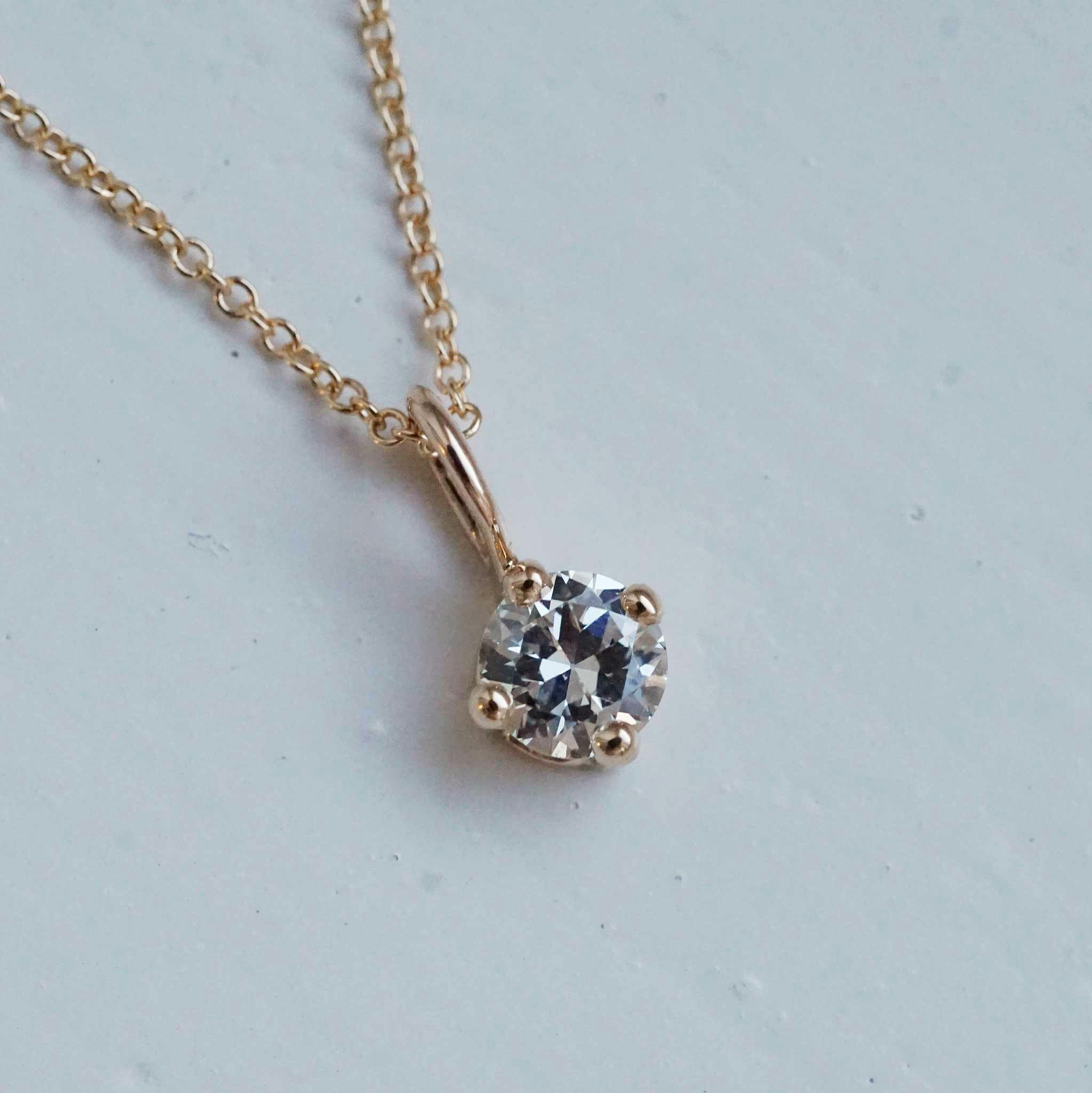 "Sirius" pendant in gold with an 0.36ct old european cut diamond