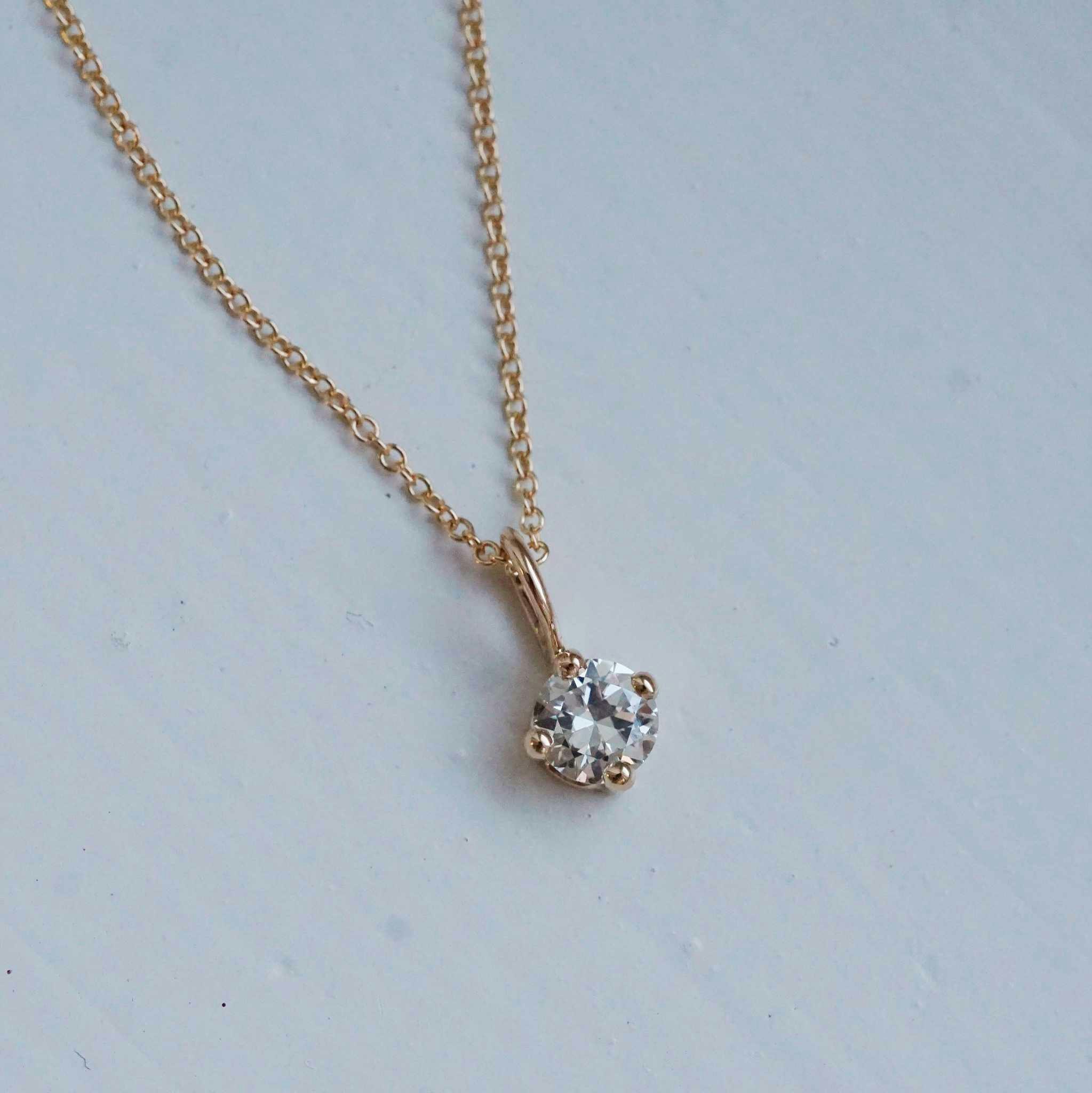 "Sirius" pendant in gold with an 0.36ct old european cut diamond