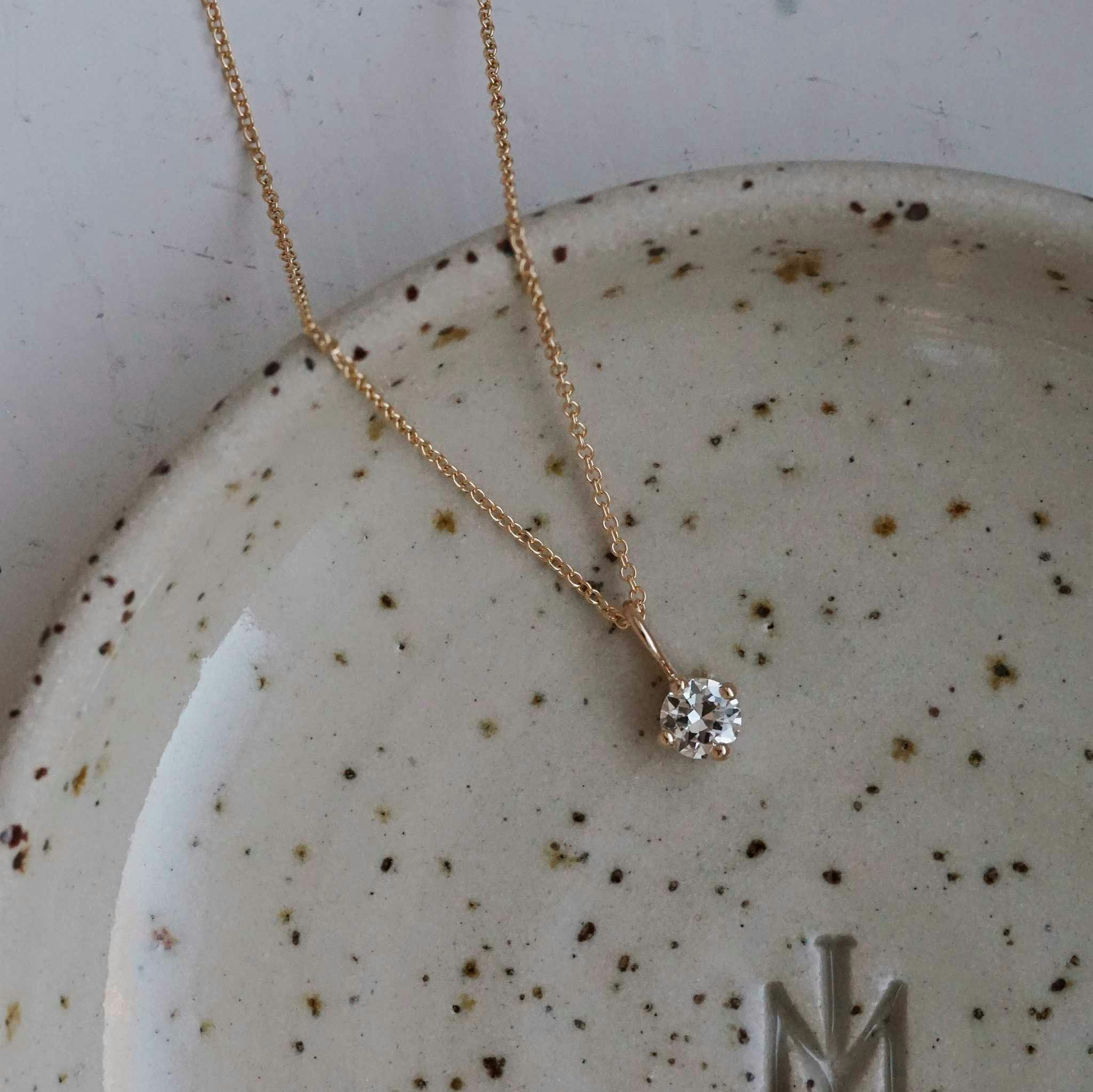 "Sirius" pendant in gold with an 0.36ct old european cut diamond