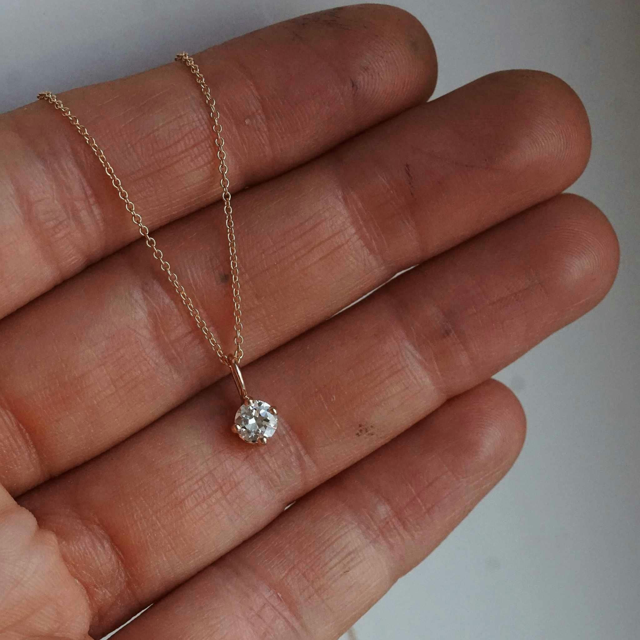 "Sirius" pendant in gold with an 0.36ct old european cut diamond