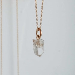 "Swedish Ice" Pendant in gold with a raw Swedish rock crystal