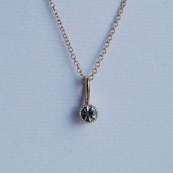"Twinkle" pendant in gold with a multicolored sapphire