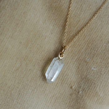 "Swedish Ice" Pendant in gold with a raw Swedish rock crystal