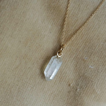 "Swedish Ice" Pendant in gold with a raw Swedish rock crystal