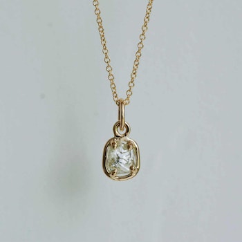 "Raw" pendant with a raw diamond