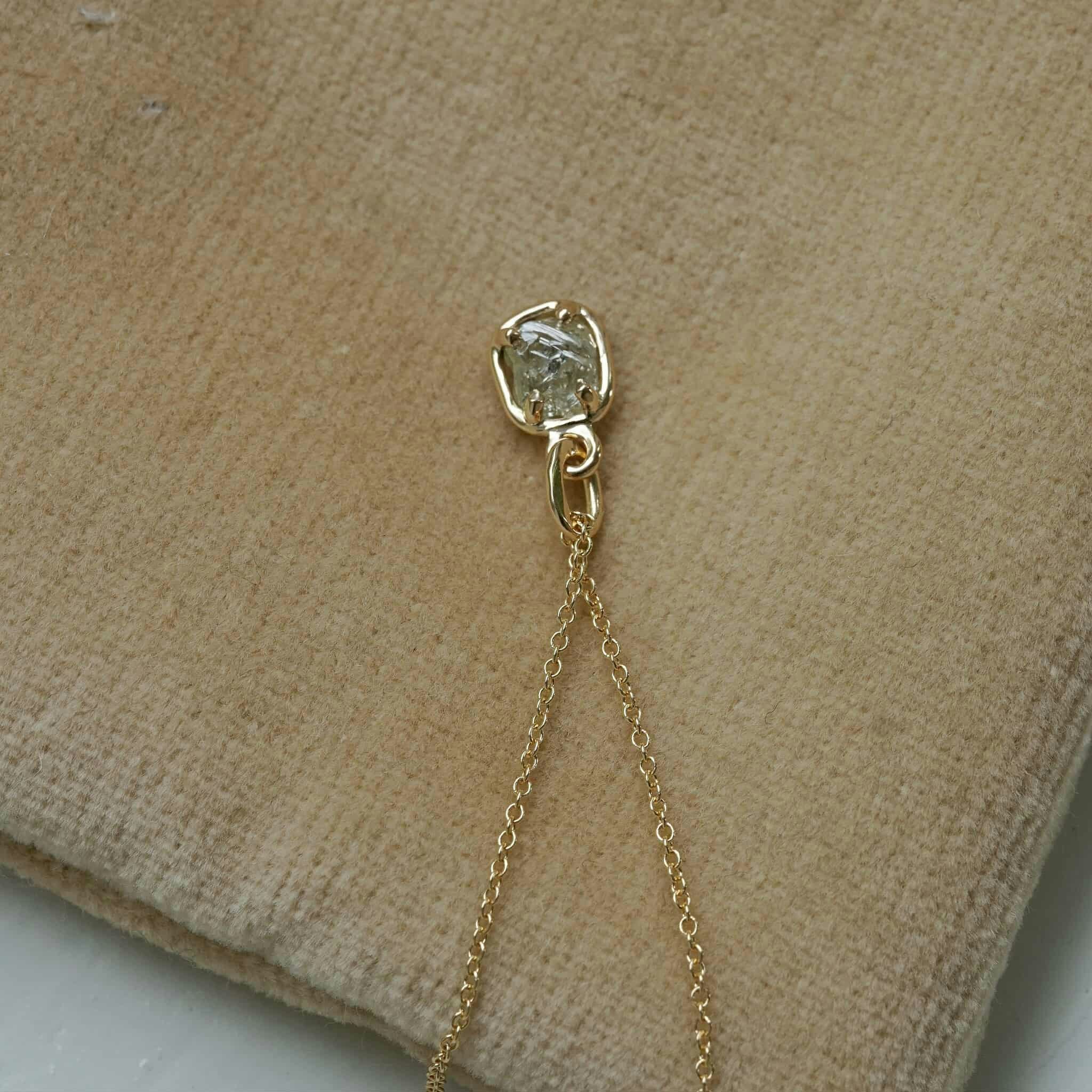 "Raw" pendant with a raw diamond