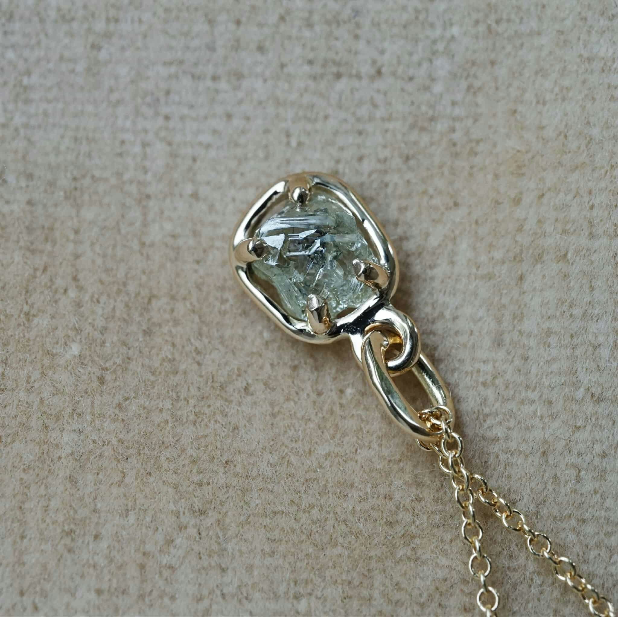 "Raw" pendant with a raw diamond