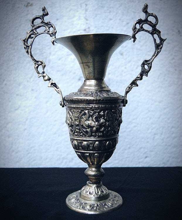 Gold-colored ornamental urn