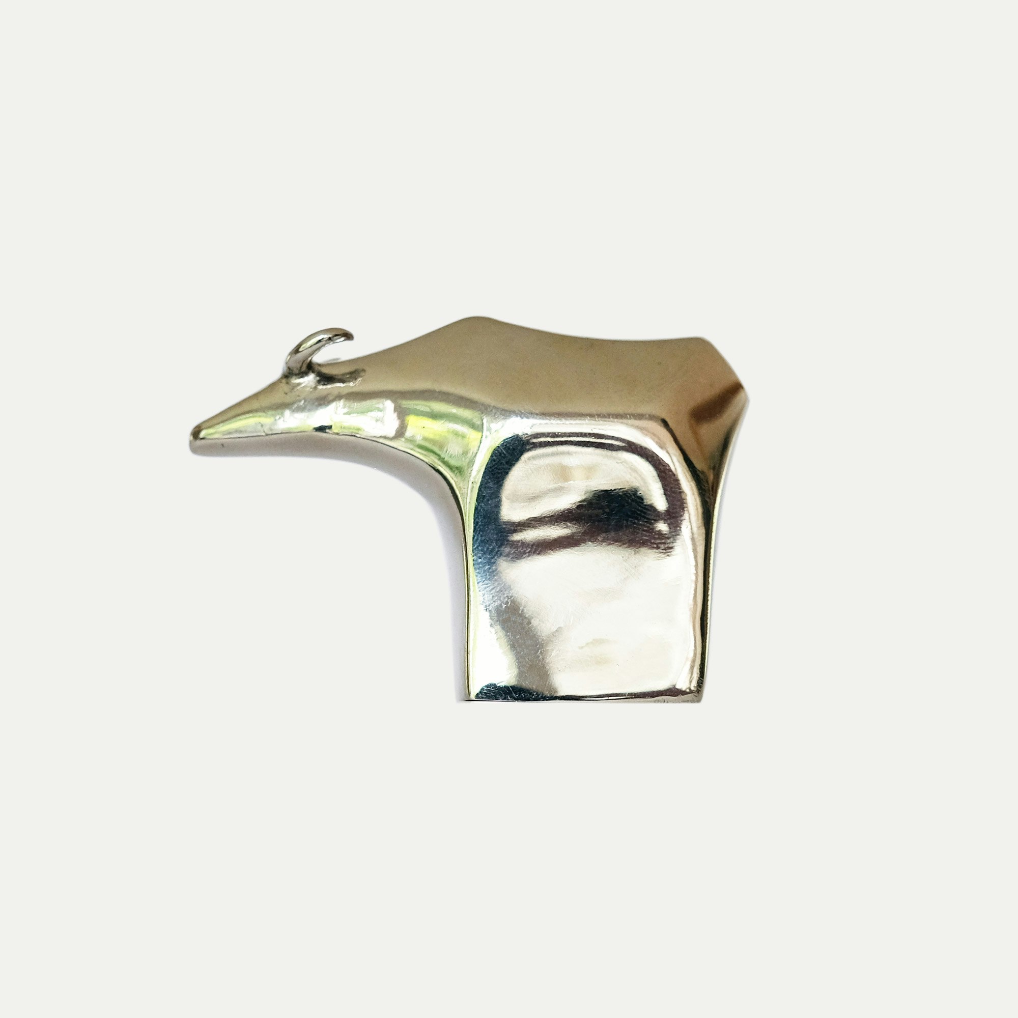 Water Buffalo in polished white metal.