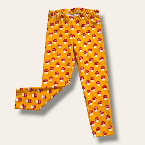 Gula leggings med flugsvampar - storlek 86/92