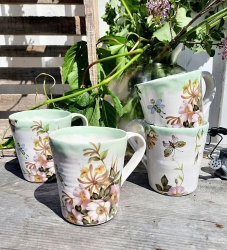 KAFFEMUGG MED SAGOLIKT MOTIV