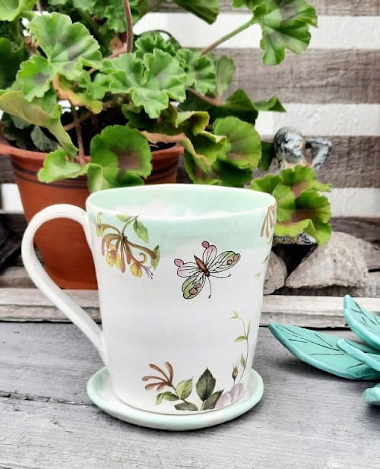 KAFFEMUGG MED SAGOLIKT MOTIV